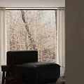 Black Leather Single Sofa In Living Room With Gray Terrazzo Wall And Curtains