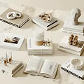 Stacked Books With Sculptures Cups And Small Decor In Minimalist Elegant Style