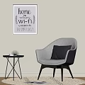 Modern Single Sofa With Gray Cushion Small Side Table Decorative Wall Art And Area Rug