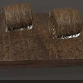 Two Round Hay Bales Placed On Square Wooden Base With Dry Straw
