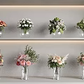 Various Flower Bouquets in Transparent Vases on White Layered Shelves