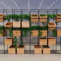 Shelf Unit With Black Metal Frame And Wooden Planters Holding Green Plants