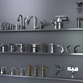 Various Stylish Faucets Displayed On Gray Shelves With Different Designs And Finishes