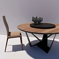 Round Wooden Dining Table Set With Beige Chair Black Tray And Sculpture Decor