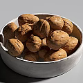 Healthy Organic Walnuts Filled in Ceramic White Bowl on Simple Light Background