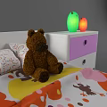 White Frame Kids Bed With Colorful Bedspread Teddy Bear And Nightstand Lamps