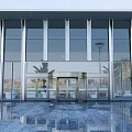 Modern Building Entrance Featuring Glass Curtain Walls Revolving Door And Metal Frames