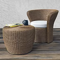 Rattan Leisure Chair with White Cushion and Side Table on Wooden Floor with Gray Wall