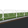 White Metal Roadside Railing With Green Plants And Trees Along Grassland