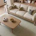 Modern Beige Sofa With Cushions And Wooden Coffee Table Set On Striped Rug