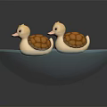 Two Adorable Small Duck Toys Sitting In Blue Decorative Bowl
