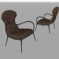 Two Brown Upholstered Accent Chairs With Curved Arms And Slim Metal Legs