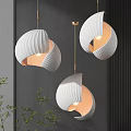 Modern Curved Ribbed White Pendant Lights With Warm Light Grey Wall And Green Plants