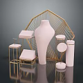 Elegant Gold Geometric Decor Frame With Pink Vase Round Stands And Square Cushions