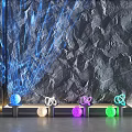 Gray Textured Background Wall With Blue Laser Beams And Colorful Glowing Spheres On Metal Base