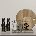 Round Wooden Cutting Board With Black White Clear Spice Bottles And Coffee Woven Bag