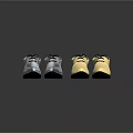 Stylish Silver And Gold Shoes With Shoelaces Reflective Material Three Pairs On Black Background