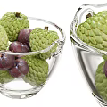 Transparent Ceramic Bowls Containing Fresh Green Custard Apples And Purple Plums