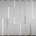 Modern White Wall Design with Square Panels in Varied Sizes and Edge Lighting