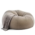 Comfortable Beige Bean Bag Chair With Gray Blanket For Cozy Living Room