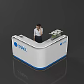 White And Blue Reception Desk With MAX Logo And Female Staff Near Flower Arrangement