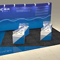 Modern Exhibition Display Shelves With Transparent Counters And Blue Booth Layout 3d model