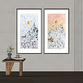 Two Framed Snowy Mountain Sun Paintings On Wall With Small Wooden Table Plant And Books