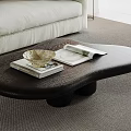 Unique Black Coffee Table with Books and Decorative Bowl in Modern Living Room Setting