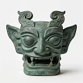 Ancient Bronze Landscape Sculpture With Mythical Face Large Eyes Fanged Mouth Curled Horns