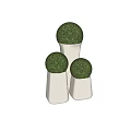 Small Garden Decor With Three White Cylindrical Bases And Green Spherical Plants
