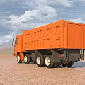 Orange Large Dump Truck Driving On Sandy Ground Under Blue Sky White Clouds