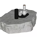 Natural Stone Coffee Table With Textured Surface And Black Decorative Items 3d model