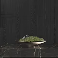 Green Moss In Ceramic Bowl On Marble Counter With Dark Wooden Wall And Soft Lighting