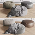 Stylish Round Gray Brown Fabric Leather Ottomans With Textured Blanket On Wooden Floor Minimalist Setting