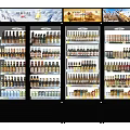 Commercial Glass Door Display Refrigerators Stocked With Various Beverages And Drinks
