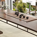 Chinese Style Wooden Tea Table and Chairs with Tea Sets Calligraphy and Green Plants