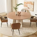 Round Wooden Dining Table Set with Four Brown Chairs on Striped Rug and Plants