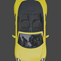Stylish Yellow Porsche Convertible Sports Car With Black Wheels And Sleek Front Design