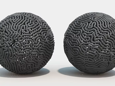 Two Black Spherical Art Installations With Intricate Maze Like Surface Patterns 3d model