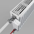 White Radiator With Vertical Panels Connected Pipes And Red Valve For Home Heating