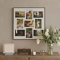 Stylish Photo Wall With Family Lifestyle Photos And White Tulip Vase On Wooden Table