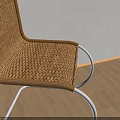 Modern Leisure Chairs With Woven Rattan Seats And Metal Curved Frames In Minimalist Interior