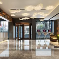 Modern Hotel Lobby With Cloud Shaped Chandeliers Marble Floor And Green Seating Area