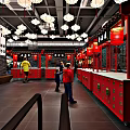 Traditional Chinese Restaurant Interior With Red Counters And Hanging Lantern Decorations