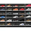 Various Style Shoes In Different Colors Neatly Arranged On Display Shelves