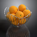 Fresh Ripe Oranges in a Metal Wire Basket on Reflective Surface