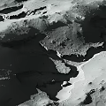 Moon Landscape Displaying Crater Formations Undulating Terrain and Rugged Surface with Natural Shadow Patterns