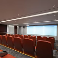 Cinema Interior Design With Modern Comfortable Orange Seats And Spacious Layout For Movie Viewing Experience