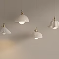 White Pendant Lights With Various Designs Hanging On White Wall