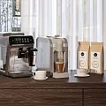 Modern Coffee Makers As Kitchen Appliances With Cups And Bean Bags On Wooden Counter